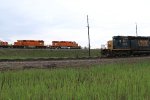 A pair ob EJ&E SD38-2's work their old home rails as a CSX job passes in front